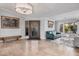 Spacious foyer featuring tile flooring, decorative lighting, and a comfortable seating area by the window at 21666 N 53Rd Dr, Glendale, AZ 85308