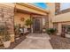 Inviting entryway with a stylish door, decorative stonework, and charming accents create a warm welcome at 21666 N 53Rd Dr, Glendale, AZ 85308