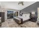 Spacious main bedroom with sliding glass doors and a view of the lake at 21666 N 53Rd Dr, Glendale, AZ 85308