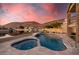 Luxurious pool with attached hot tub and serene waterfront backdrop at 21666 N 53Rd Dr, Glendale, AZ 85308