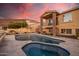 Beautiful backyard pool and hot tub with elegant stone surround at 21666 N 53Rd Dr, Glendale, AZ 85308