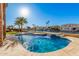 Beautiful backyard swimming pool and spa with waterfall feature and picturesque waterfront views at 21666 N 53Rd Dr, Glendale, AZ 85308