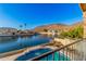 Scenic water view from a balcony overlooking a private pool, waterway, and hillside homes at 21666 N 53Rd Dr, Glendale, AZ 85308