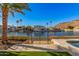 Waterfront access from backyard with wrought iron gate leading to neighborhood waterways at 21666 N 53Rd Dr, Glendale, AZ 85308