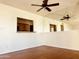 Living room with view into the kitchen over a granite topped partition and mirrored wall at 240 S Old Litchfield Rd # 208, Litchfield Park, AZ 85340