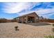 Large backyard with low-maintenance landscaping featuring a covered patio at 2466 E Rosario Mission Dr, Casa Grande, AZ 85194