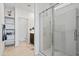 Clean and bright bathroom with a glass-enclosed shower, shelving, and modern fixtures at 2466 E Rosario Mission Dr, Casa Grande, AZ 85194