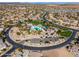 Aerial view of community pool, playground, and park area in a residential neighborhood at 2466 E Rosario Mission Dr, Casa Grande, AZ 85194