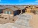 Single-story home showcasing neat landscaping, a stone facade, and a spacious driveway at 2466 E Rosario Mission Dr, Casa Grande, AZ 85194