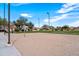 Sand volleyball court ready for friendly games in a vibrant community setting, great for outdoor recreation at 2466 E Rosario Mission Dr, Casa Grande, AZ 85194