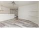 Bonus room with wood-look flooring, neutral paint, and built-in shelving at 2551 E Kent Ave, Gilbert, AZ 85296