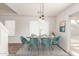 Elegant dining area featuring modern chairs, a stylish table, and ample natural light at 2551 E Kent Ave, Gilbert, AZ 85296