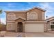 Charming two-story home with a two-car garage and desert landscaping at 2551 E Kent Ave, Gilbert, AZ 85296