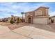 Charming two-story home with a two-car garage and desert landscaping at 2551 E Kent Ave, Gilbert, AZ 85296