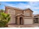 Charming two-story home with a two-car garage and desert landscaping at 2551 E Kent Ave, Gilbert, AZ 85296