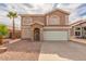 Charming two-story home with desert landscaping and a two-car garage in a sunny neighborhood at 2551 E Kent Ave, Gilbert, AZ 85296