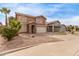 Charming two-story home with a two-car garage and desert landscaping at 2551 E Kent Ave, Gilbert, AZ 85296