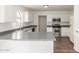 Kitchen featuring stainless steel appliances, grey countertops, and white cabinets at 2551 E Kent Ave, Gilbert, AZ 85296