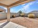 This cozy backyard includes gravel for a low maintenance space to entertain and relax at 25601 W Coles Rd, Buckeye, AZ 85326