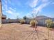 This backyard is enclosed with a block wall, with gravel landscaping for low maintenance at 25601 W Coles Rd, Buckeye, AZ 85326