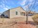 The backyard of this house offers simple gravel landscaping and partial shade at 25601 W Coles Rd, Buckeye, AZ 85326