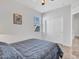 Cozy bedroom with neutral carpet, ceiling fan, and a window to let in natural light at 25601 W Coles Rd, Buckeye, AZ 85326