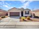 Inviting single-Gathering home with a two-car garage and attractive desert landscaping at 25601 W Coles Rd, Buckeye, AZ 85326