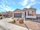 Attractive single-Gathering home with a two-car garage and drought-tolerant landscaping at 25601 W Coles Rd, Buckeye, AZ 85326