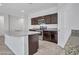 Modern kitchen featuring a large island, granite countertops, and stainless steel appliances at 25601 W Coles Rd, Buckeye, AZ 85326