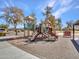 A fun community playground featuring multiple slides, climbing structures, and a shaded seating area at 25601 W Coles Rd, Buckeye, AZ 85326