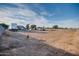 Vast backyard showcasing potential for customization and development at 26631 S Lime Dr, Queen Creek, AZ 85142