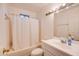 Clean bathroom featuring a single sink vanity, a toilet and a shower/tub combo at 26631 S Lime Dr, Queen Creek, AZ 85142