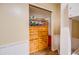 Bedroom closet featuring a dresser, wall to wall shelves and bright walls at 26631 S Lime Dr, Queen Creek, AZ 85142