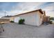 Wide shot of the detached garage with a gravel yard and desert landscaping in the backyard at 26631 S Lime Dr, Queen Creek, AZ 85142