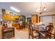 Eat-in kitchen area featuring wood cabinets, stainless steel appliances, and a dining table with seating at 26631 S Lime Dr, Queen Creek, AZ 85142