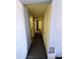 Straight and narrow hallway, featuring multiple doors to adjacent rooms at 2721 W Rose Ln, Phoenix, AZ 85017