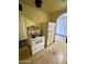 A classic kitchen design with a vintage stove and refrigerator set against a yellow backdrop at 2721 W Rose Ln, Phoenix, AZ 85017