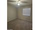 Clean bedroom featuring soft carpeting, light-colored walls, and a ceiling fan at 2837 W Angela Dr, Phoenix, AZ 85053