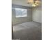 Neutral bedroom featuring soft carpeting, light-colored walls, and a ceiling fan at 2837 W Angela Dr, Phoenix, AZ 85053