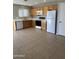 Bright kitchen with white appliances, wood cabinets, and tile flooring at 2837 W Angela Dr, Phoenix, AZ 85053