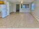 Bright living room featuring neutral walls, tile flooring, ceiling fan, and open layout to the rest of the home at 2837 W Angela Dr, Phoenix, AZ 85053