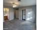 Spacious main bedroom featuring new carpet, a ceiling fan, closet, and an ensuite bathroom at 2837 W Angela Dr, Phoenix, AZ 85053