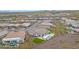 Aerial view of the backyard with a pool, putting green, patio, and low maintenance landscaping at 29348 N Clear Ridge Rd, Rio Verde, AZ 85263