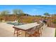 Luxury backyard with a pool, BBQ bar, and desert landscape views at 29348 N Clear Ridge Rd, Rio Verde, AZ 85263