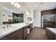 Contemporary bathroom features double vanity, tiled floors, large mirror, and glass enclosed shower at 29348 N Clear Ridge Rd, Rio Verde, AZ 85263