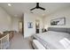 Light bedroom with a seating area, carpet, and a view into the bathroom at 29348 N Clear Ridge Rd, Rio Verde, AZ 85263