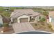 A single-Gathering house features a paved driveway, a three-car garage, and stone veneer accents at 29348 N Clear Ridge Rd, Rio Verde, AZ 85263