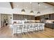 Kitchen island featuring stone countertops, pendant lighting, and bar stool seating at 29348 N Clear Ridge Rd, Rio Verde, AZ 85263