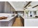 Spacious kitchen featuring stainless appliances, stone countertops, and wood floors at 29348 N Clear Ridge Rd, Rio Verde, AZ 85263