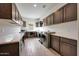 Large laundry room features plentiful counter space, washer/dryer and cabinets at 29348 N Clear Ridge Rd, Rio Verde, AZ 85263